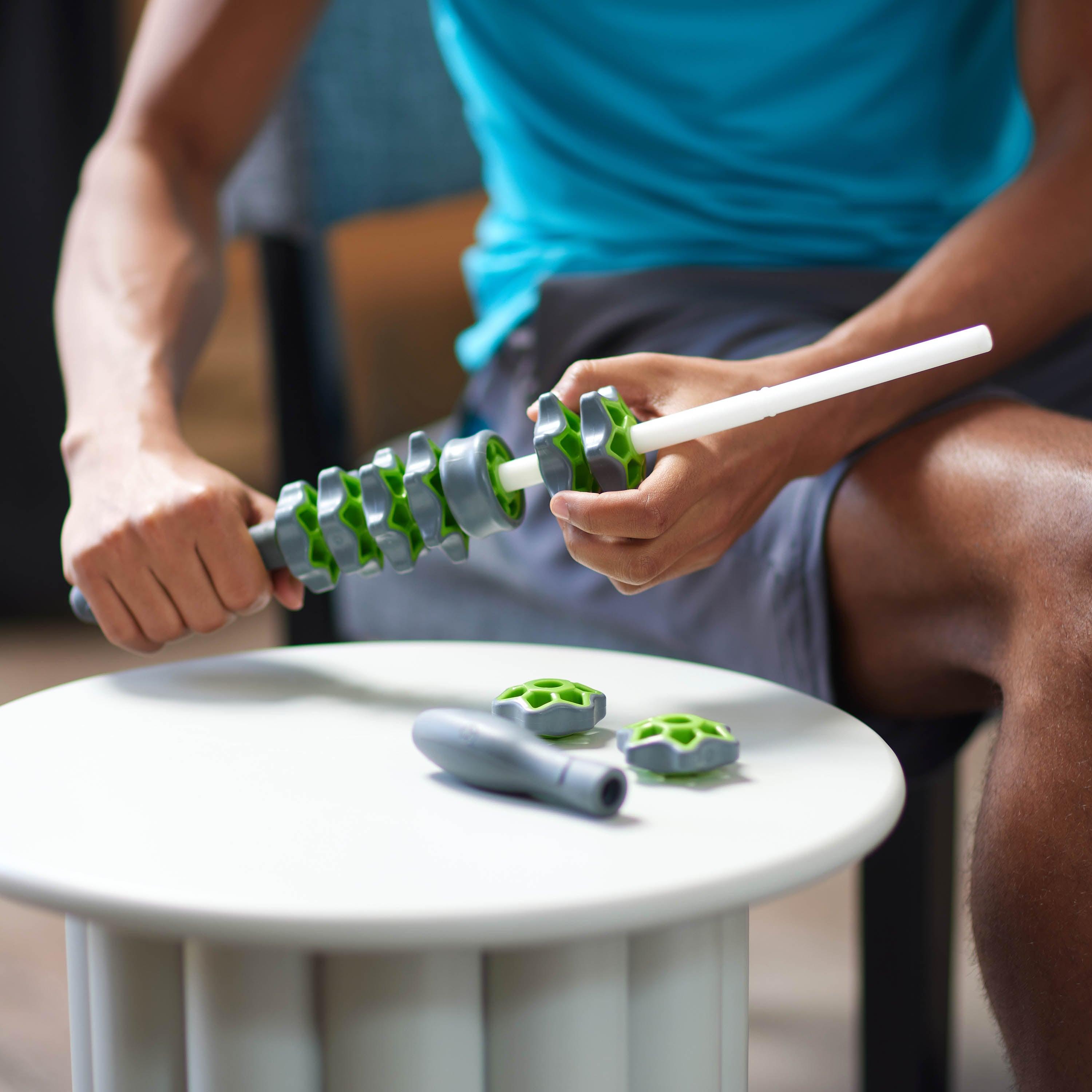 Up close image of person adjusting the Restore Adjustable Massage Roller Plus