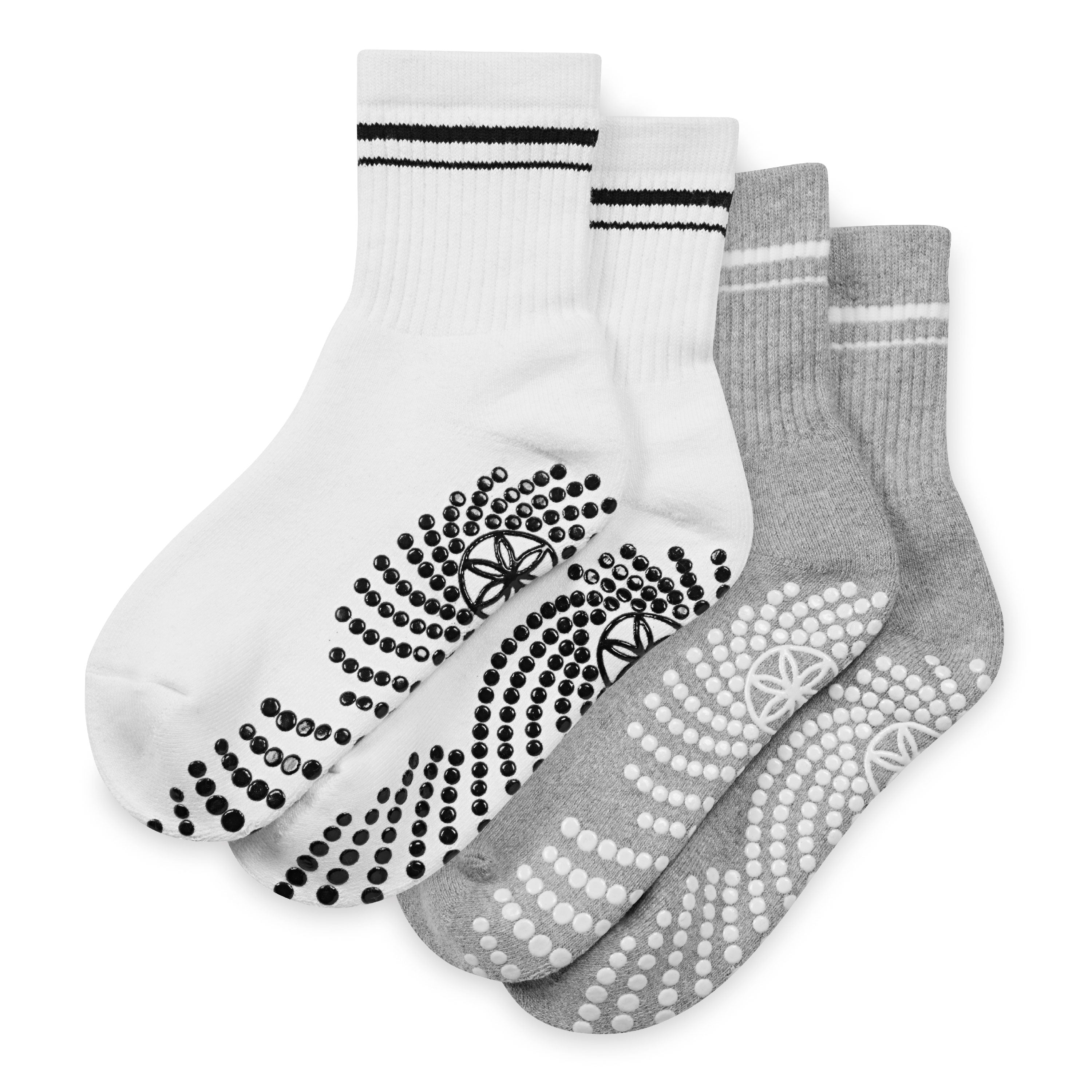 Two pairs of socks with non-slip patterns on a white background