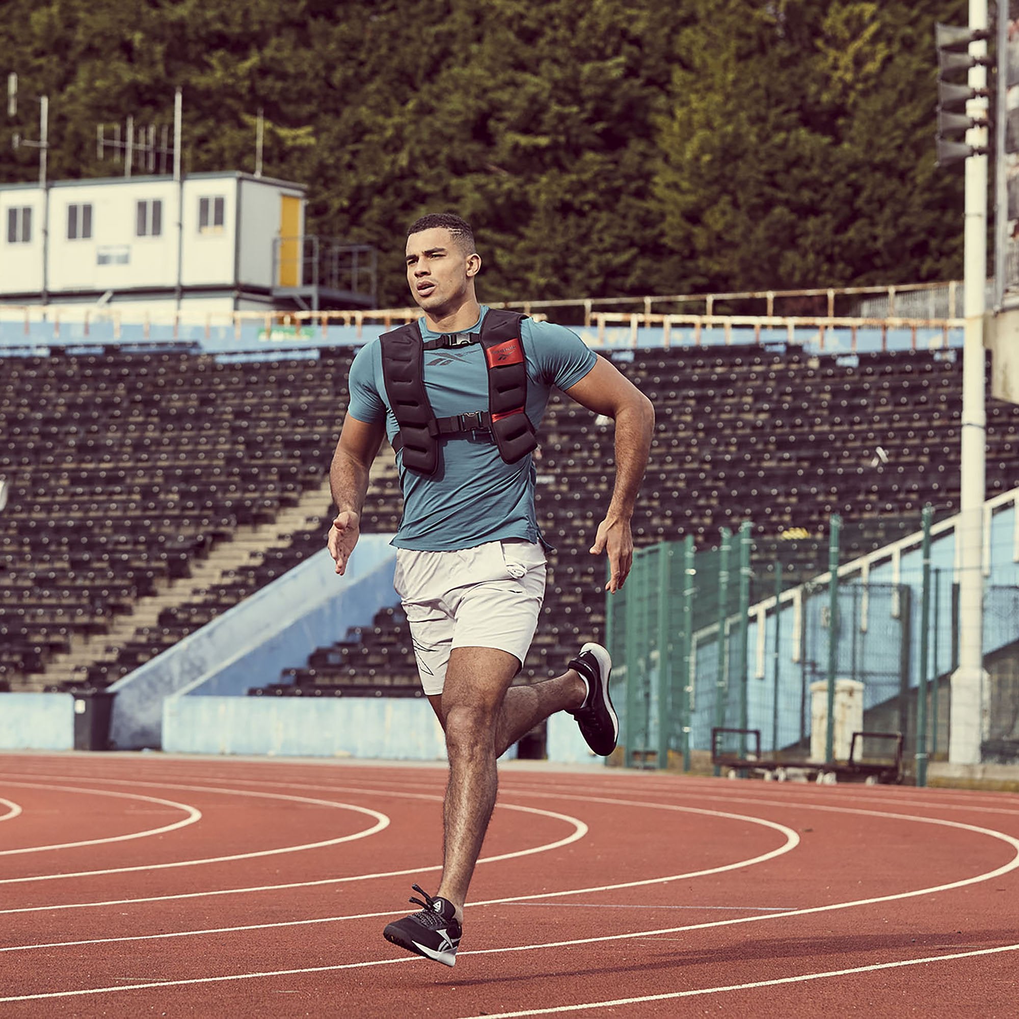 Reebok Strength Series Weight Vest front on man running on track