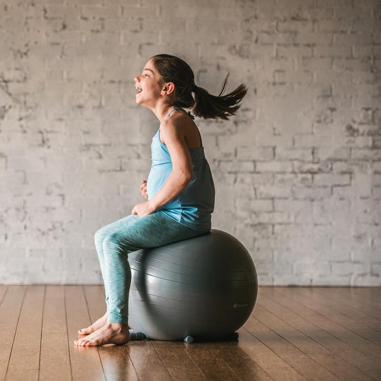 Balancing on the gray Kids Stay-N-Play Ball